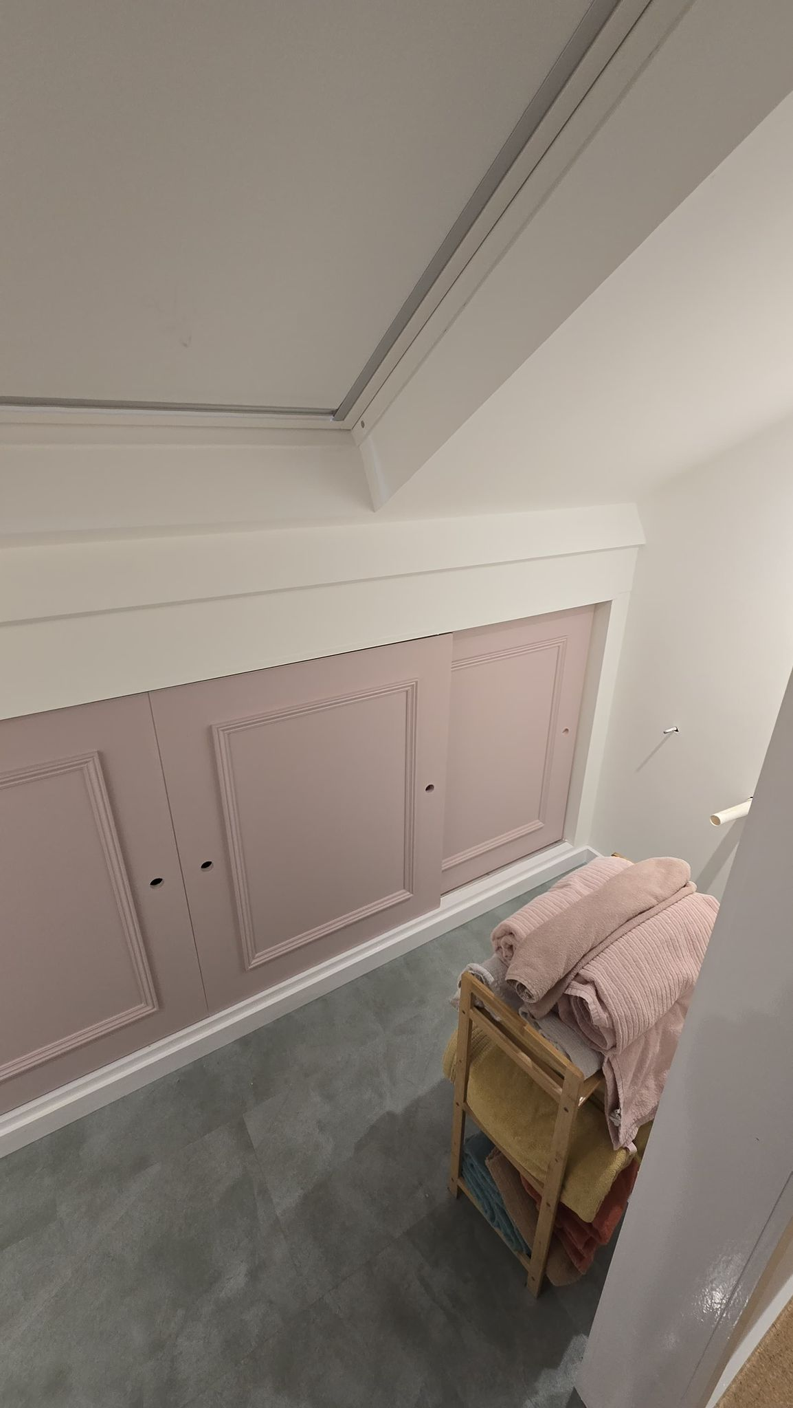 Fitted cupboards under stairs
