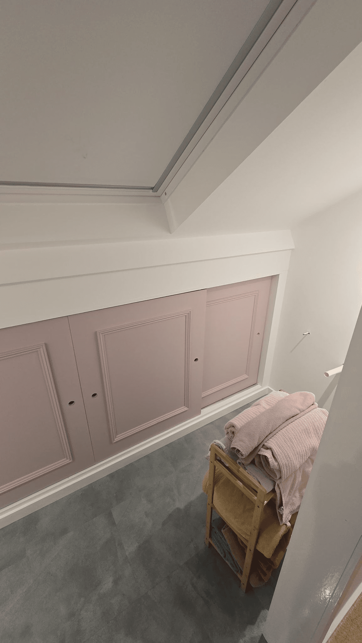 Fitted cupboards under stairs